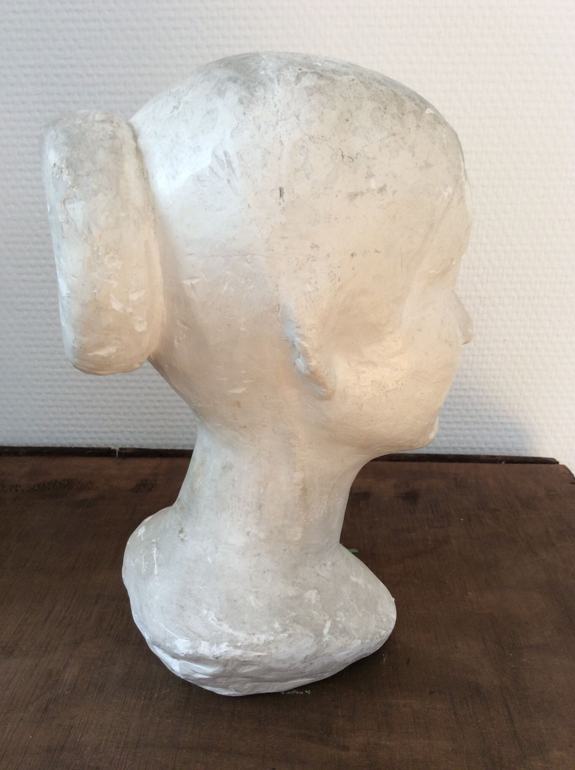 Plaster young woman at the bun