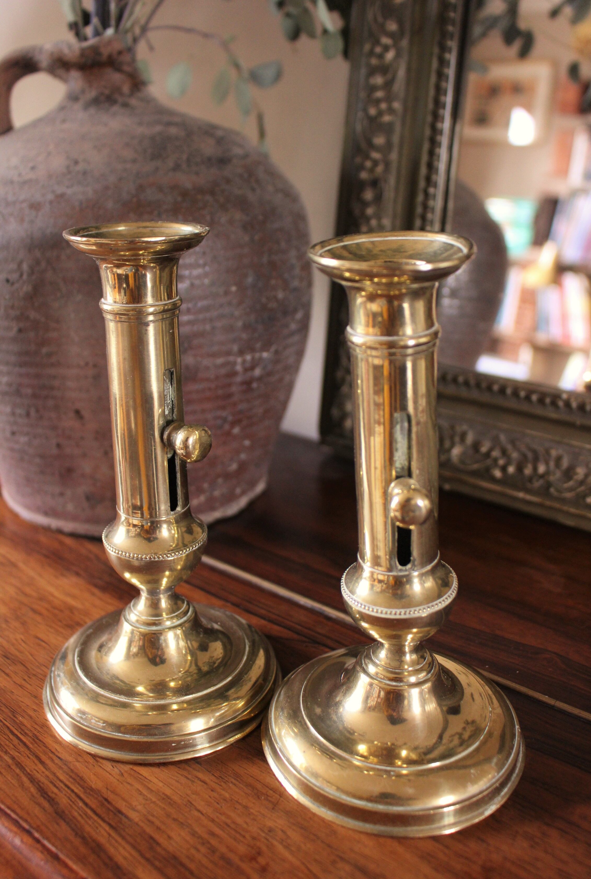 Pair brass candle holders with pusher