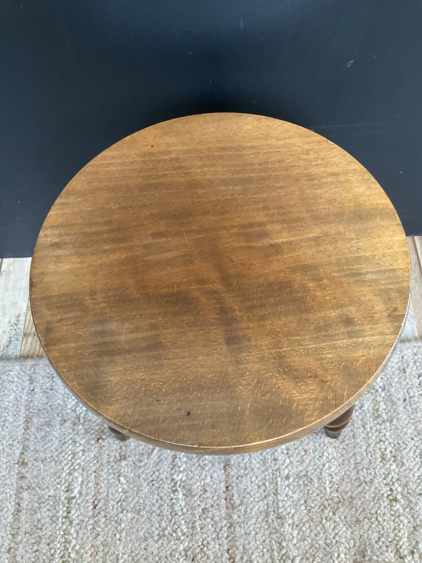 Antique tripod stool made of turned wood