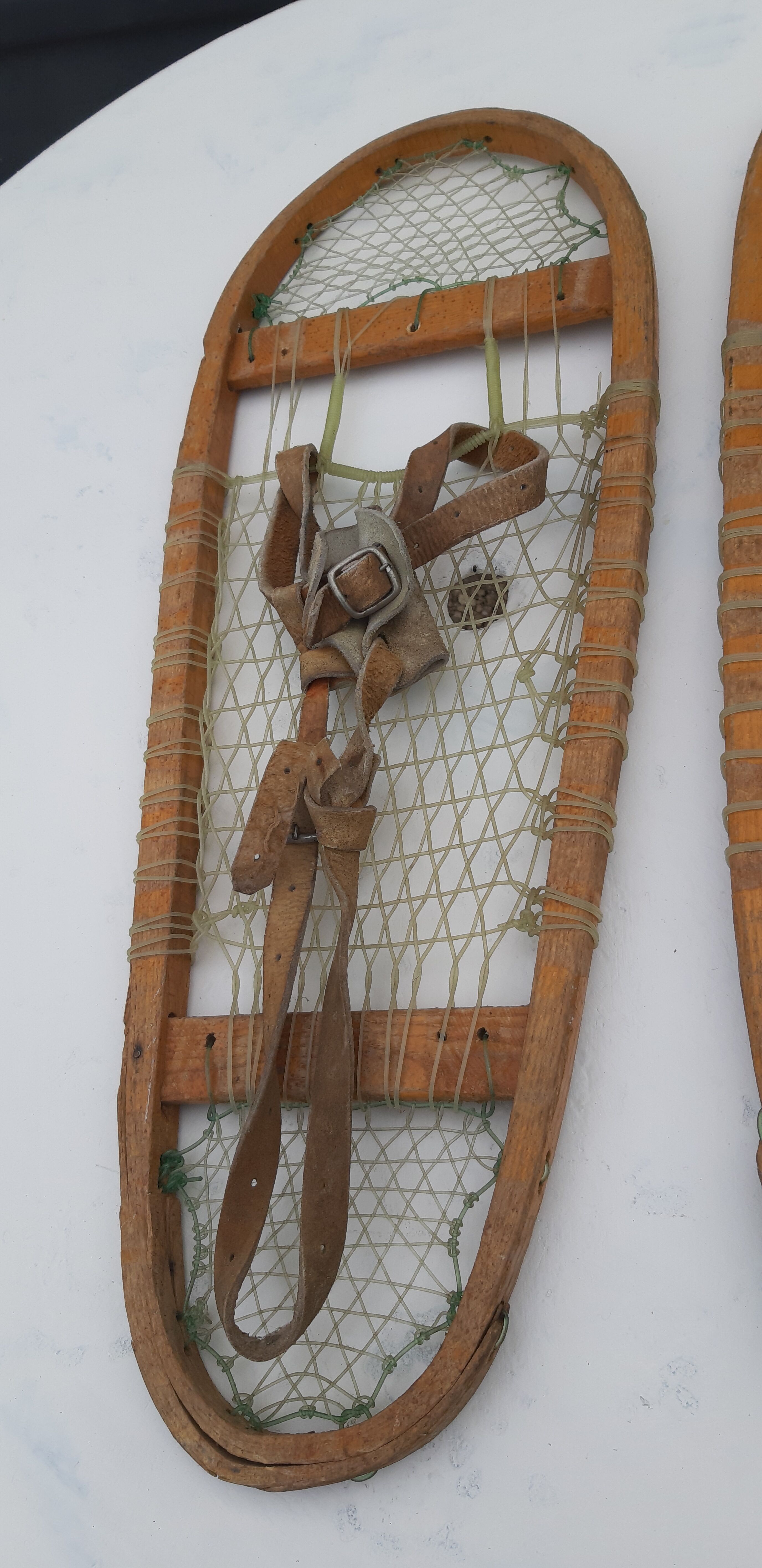 Old snowshoes made of wood and hoses