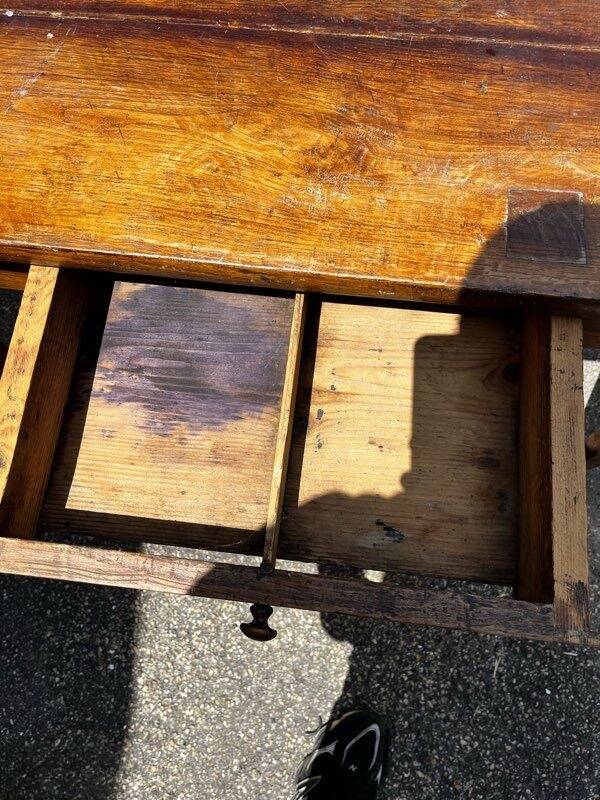 Old wooden table with a drawer