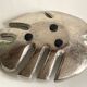 Leaf-shaped metal pocket emptier