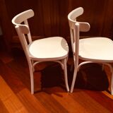 Pair of painted white bistro chairs