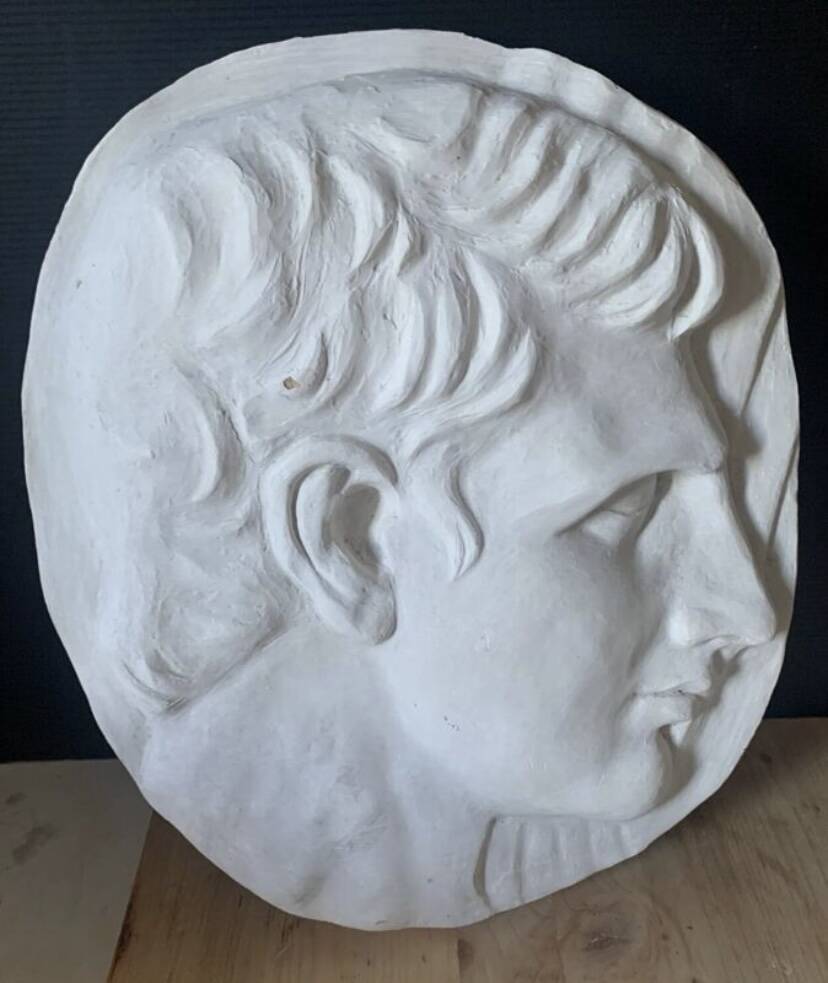 Bas relief plaster medallion
