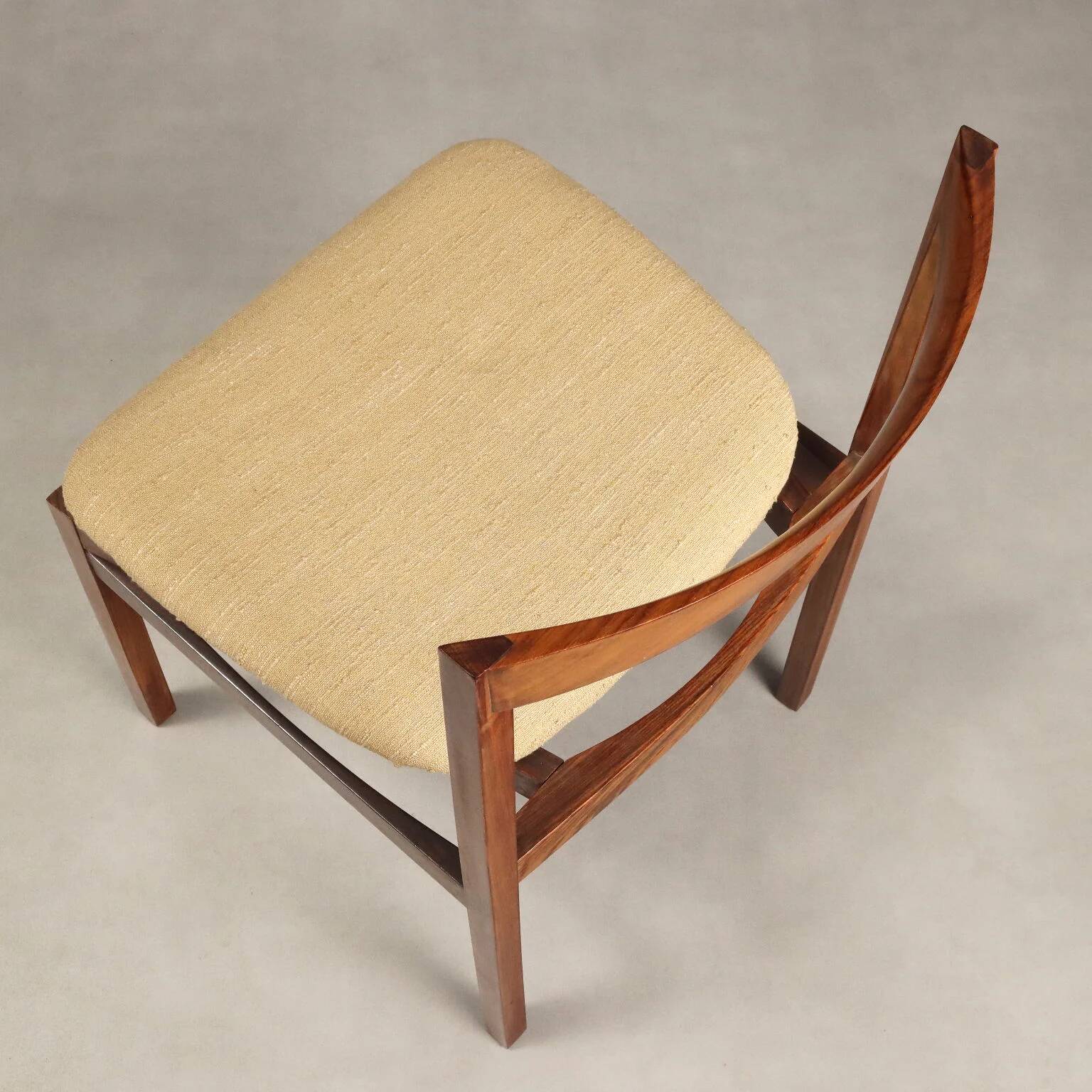 Vintage lounge chairs in exotic wood and fabric, 1960s design.