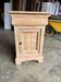Raw wood bedside table