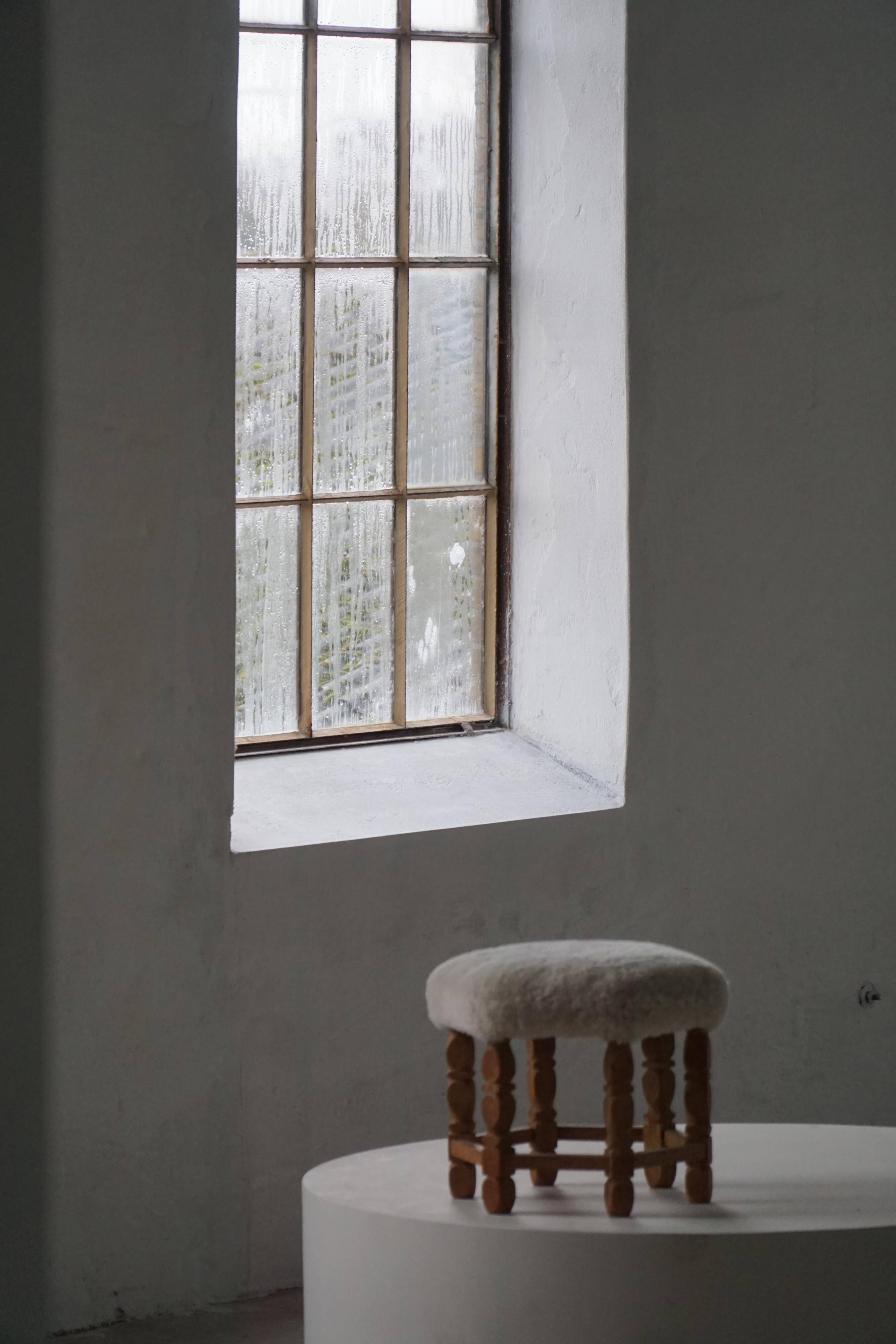 Mid-century Danish hexagonal oak stool with shearling lamb wool upholstery, 1950.