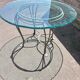 Table ronde en verre et fer forgé