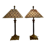 Pair of lamps in patinated gold metal