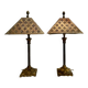 Pair of lamps in patinated gold metal