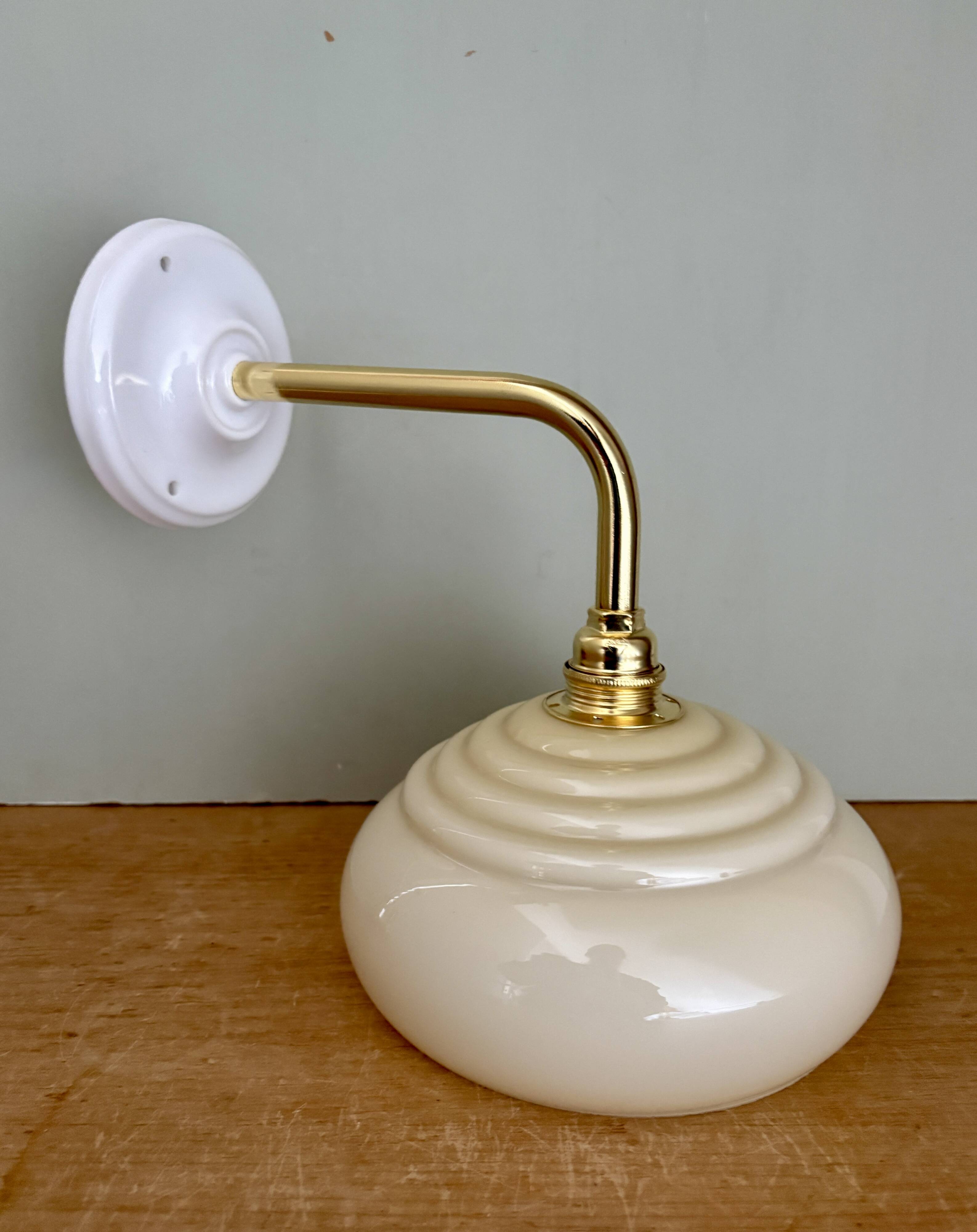 Vintage angled wall lamp with pale yellow opaline shade
