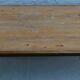 Industrial style coffee table with wooden top supported by a metal base -