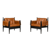 Pair of "safari" lounge chairs in cognac leather and black beech — c. 1970