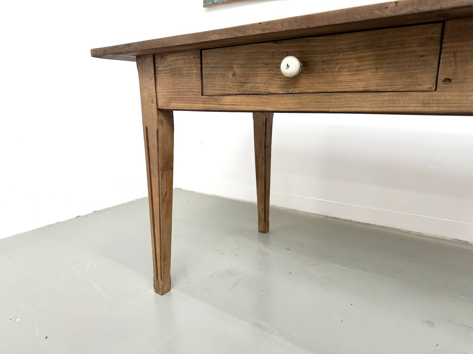 Solid pine farmhouse table, two drawers, fluted legs, France.