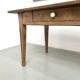 Solid pine farmhouse table, two drawers, fluted legs, France.