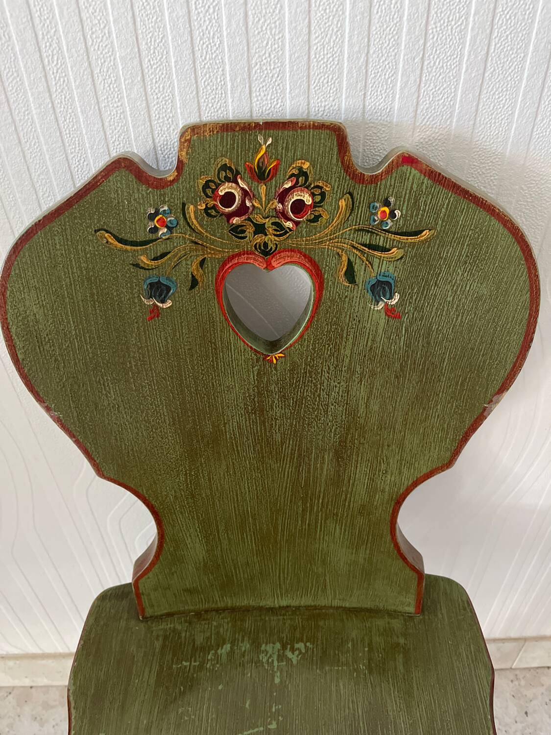 Wooden dressing table with olive green chair and floral patterns