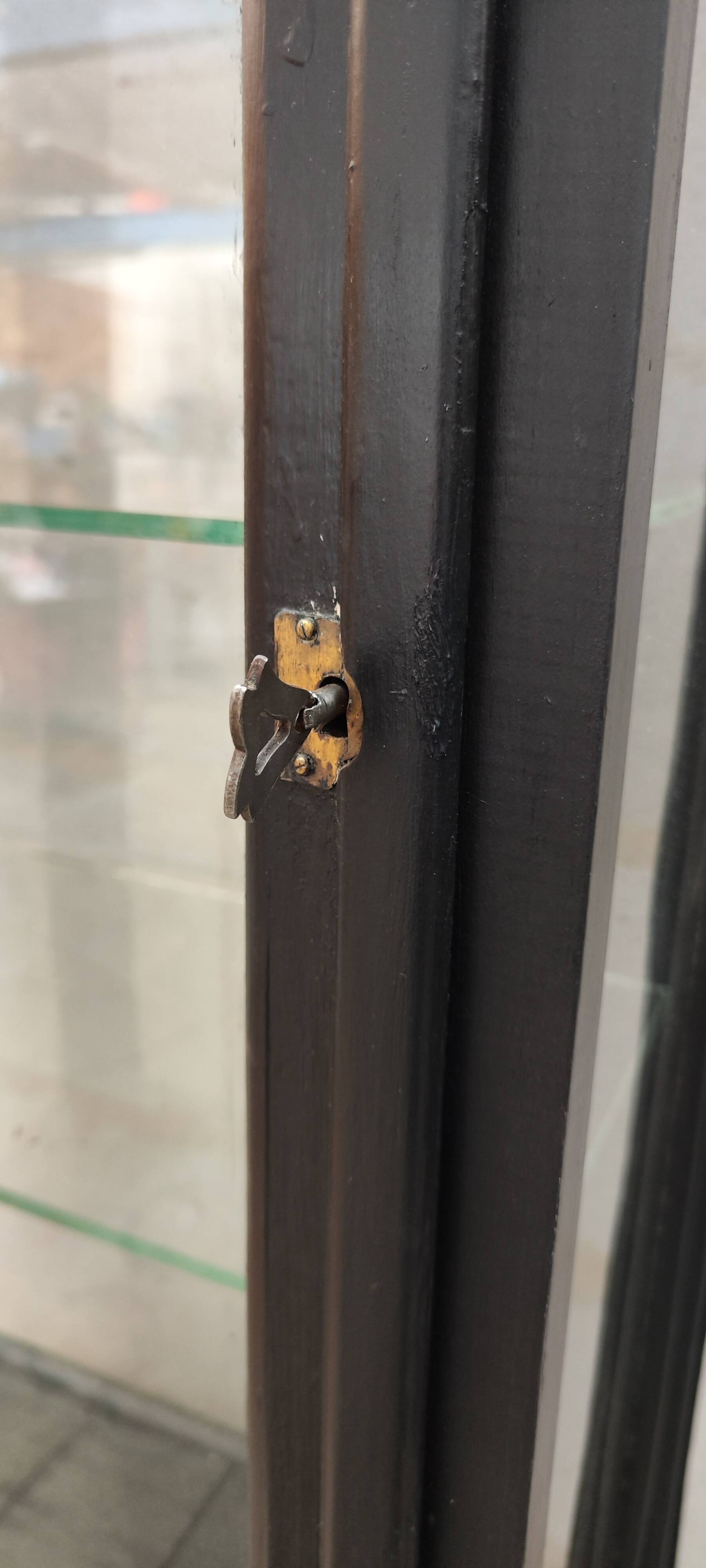 Old two-door shop showcase with black patina