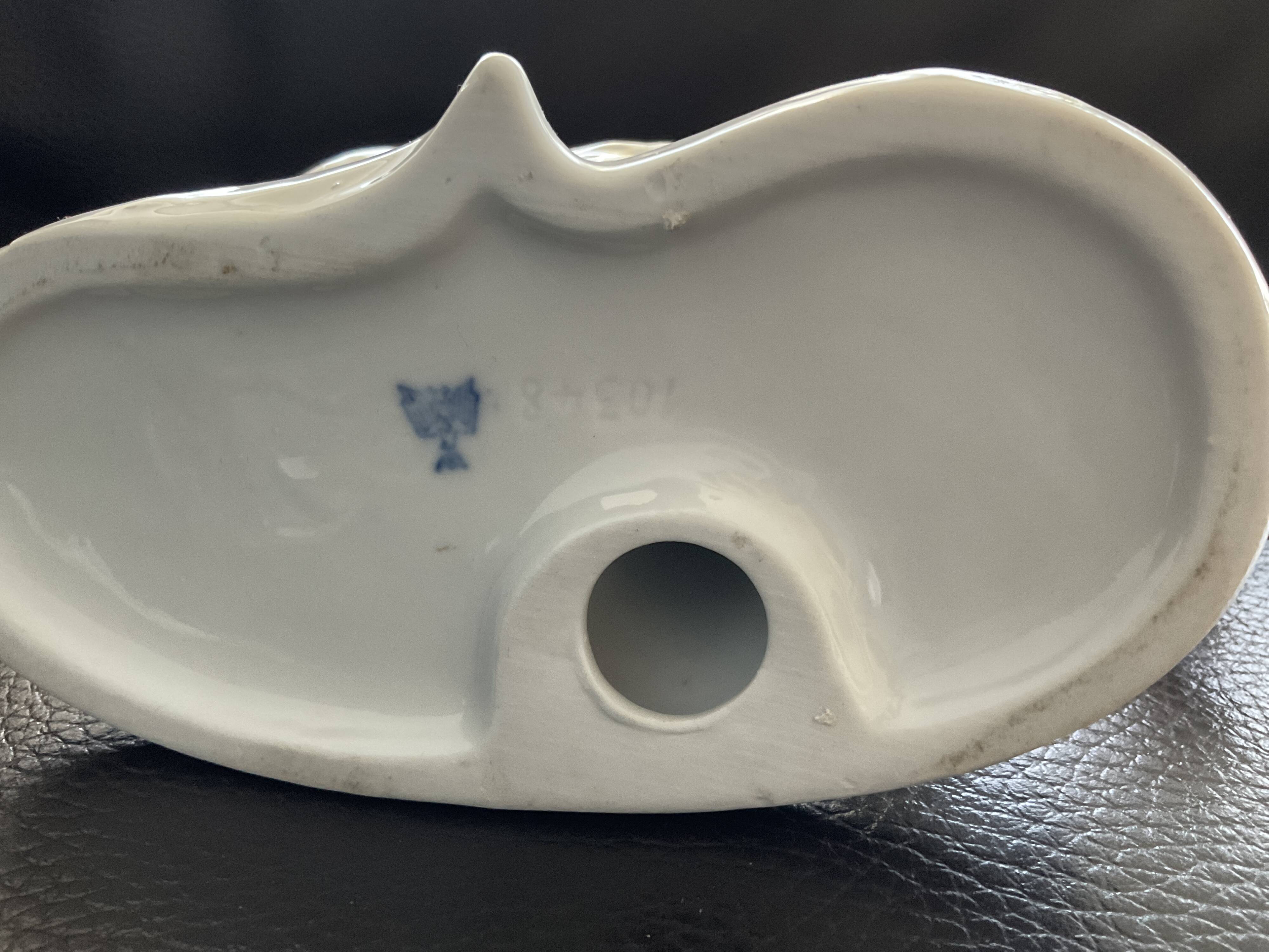 Porcelain figurine of two dogs