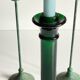 Green glass and metal candle holders