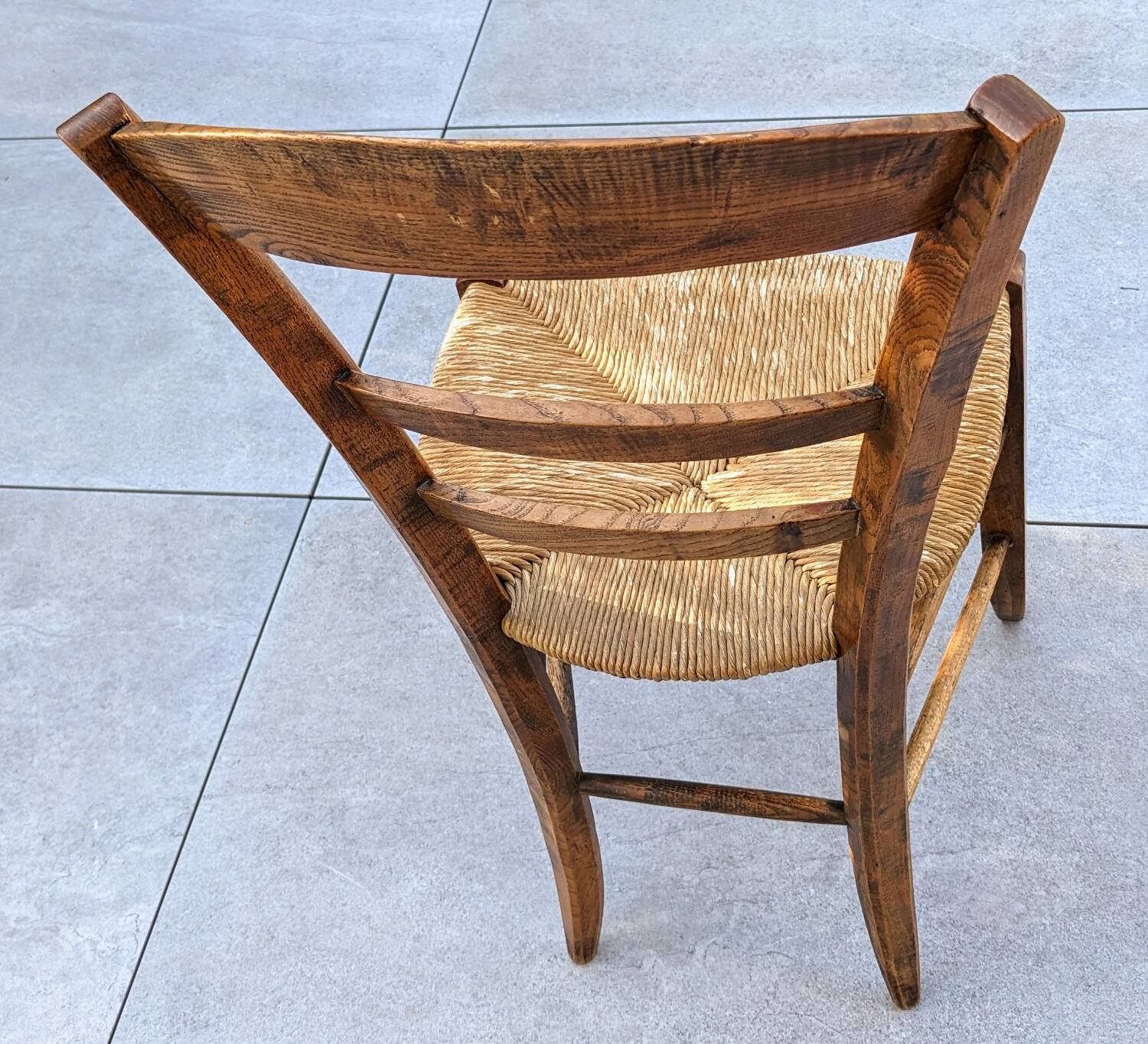 4 mismatched wood and straw chairs