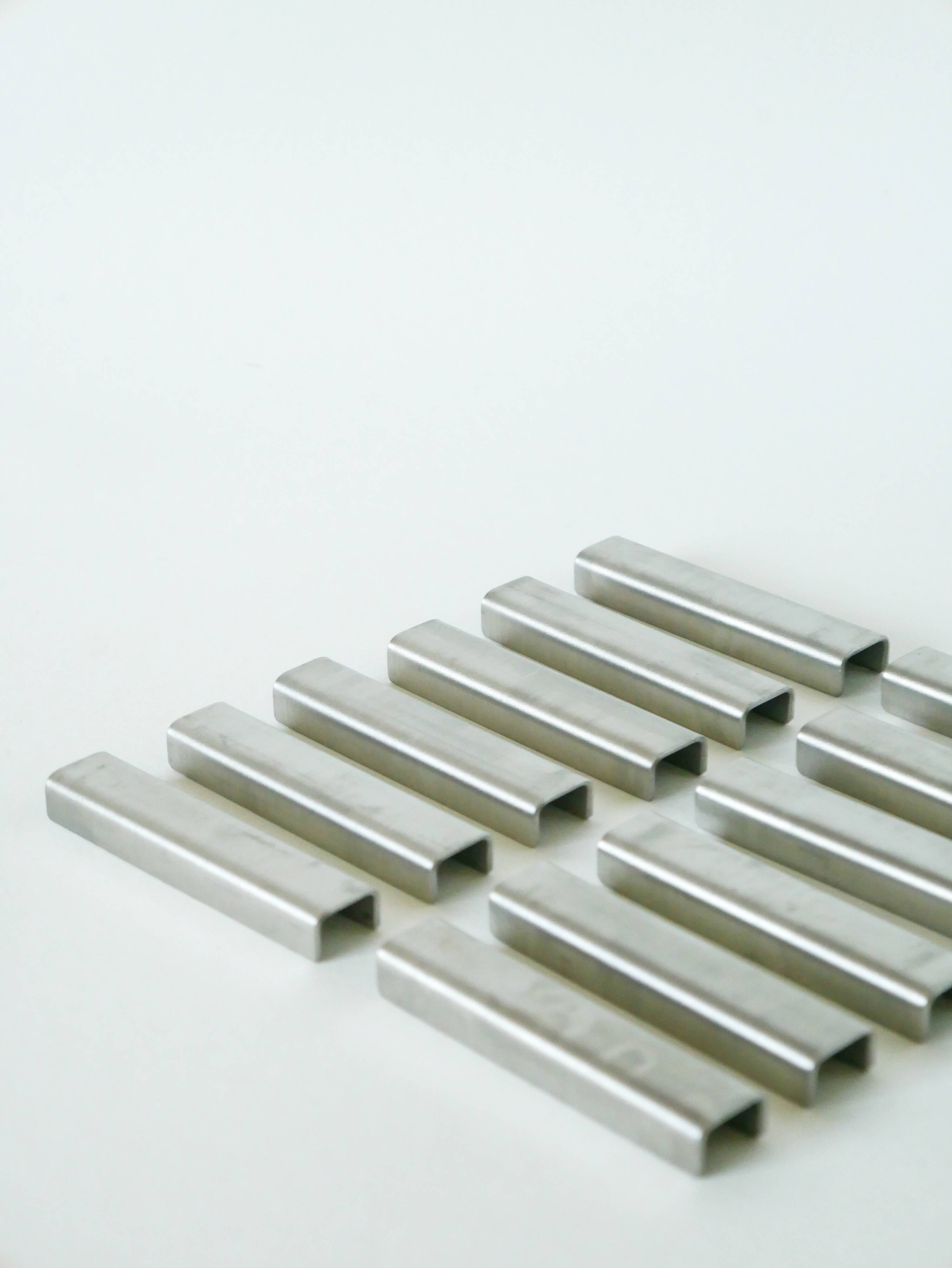 Set of 12 brushed aluminum knife holders, Design, 1970