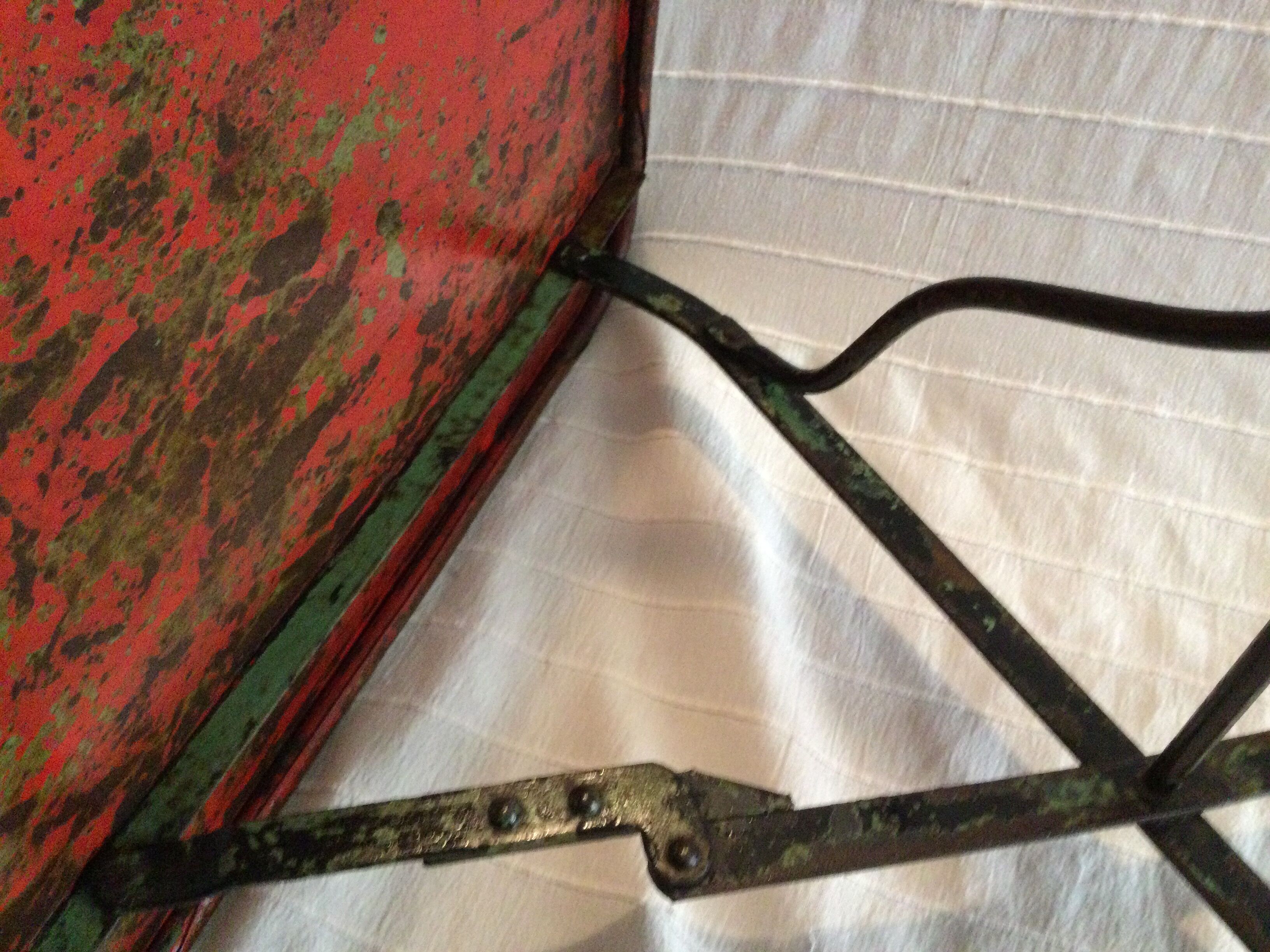 Folding riveted iron table
