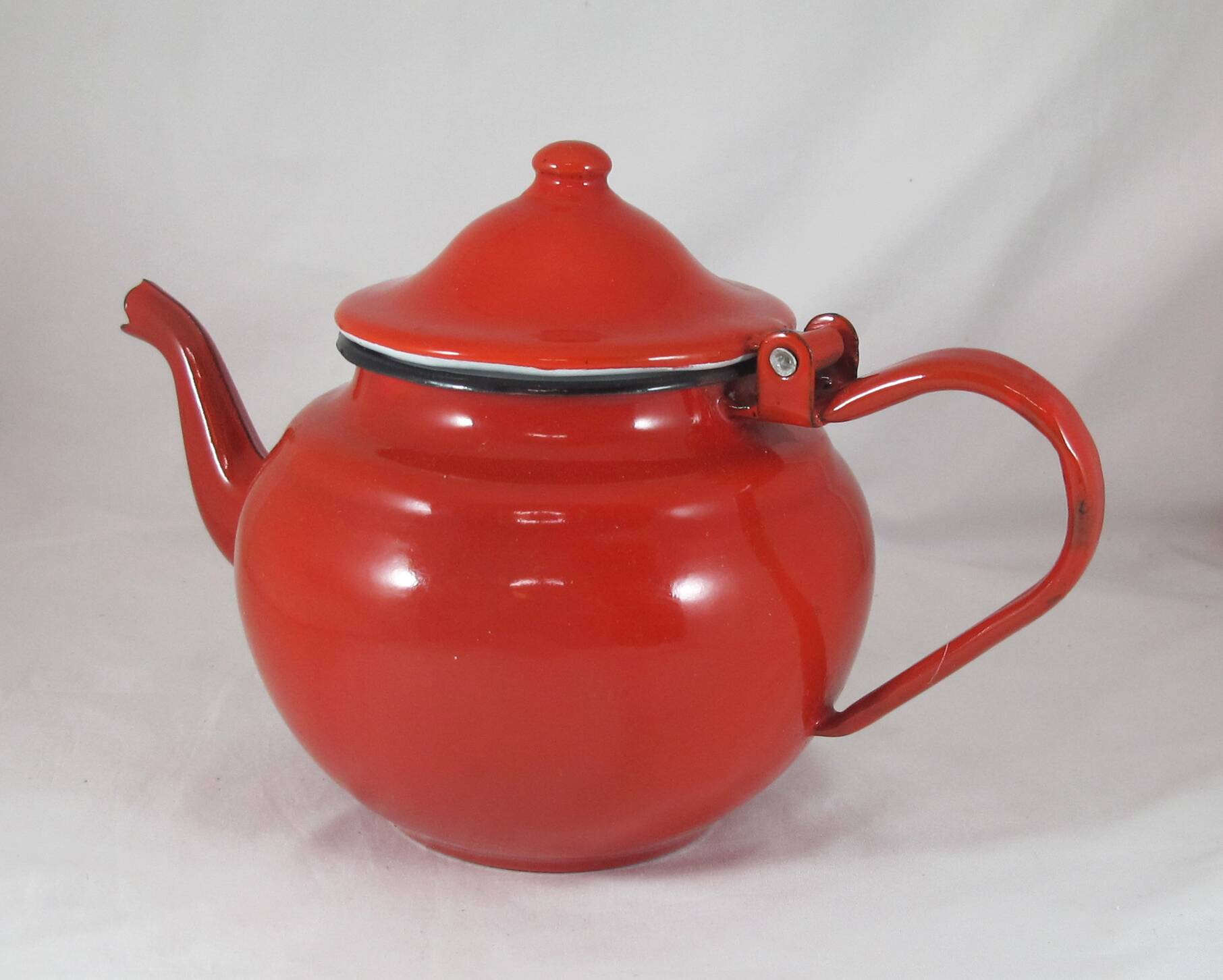 Vintage teapot coffee maker in red enameled metal