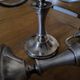 Ercuis pair of candlesticks model Cheverny in silver-plated metal with hunting horn decoration.