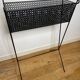 1950s black perforated metal planter in the style of Mathieu MATEGOT