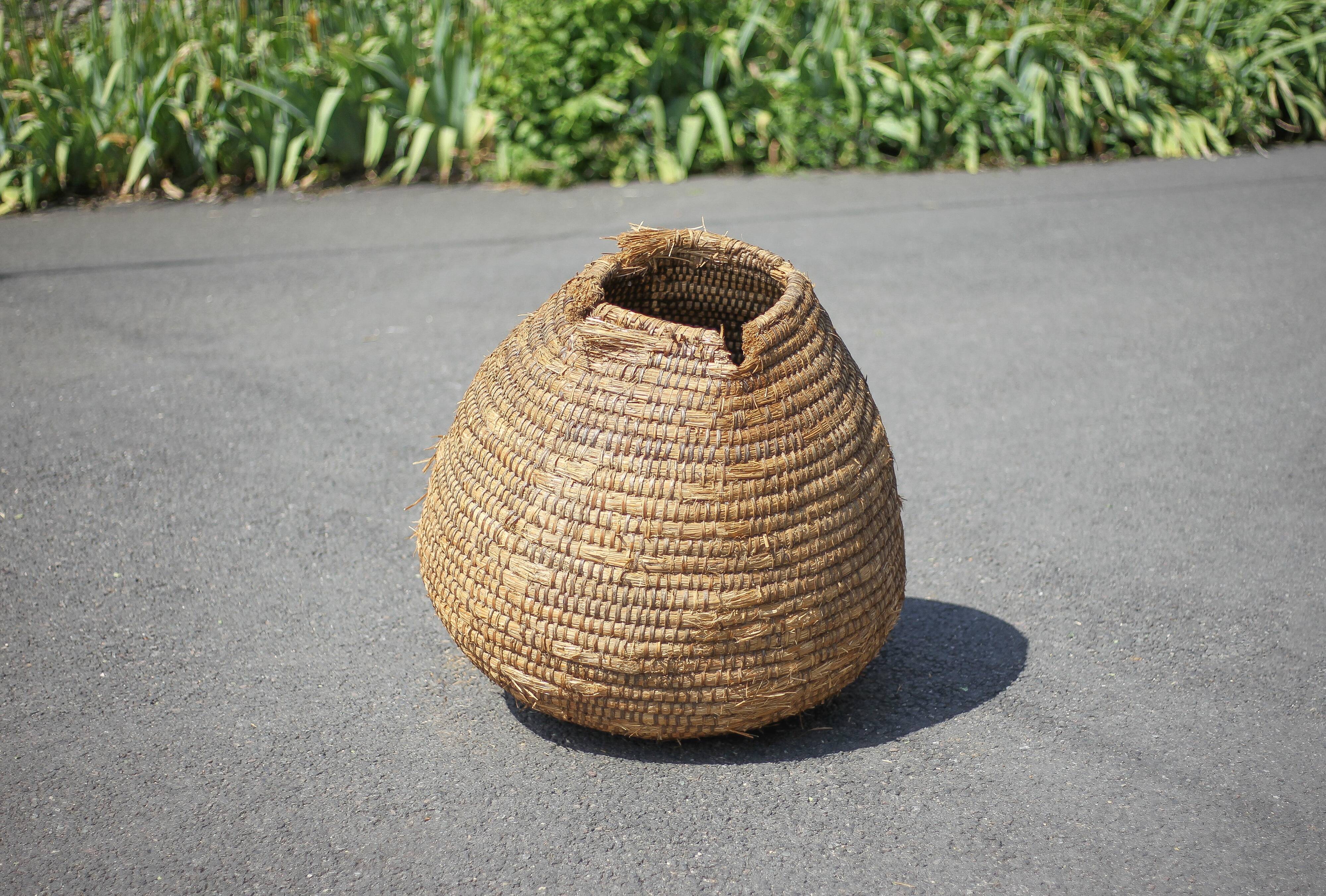 Old basket, burgundy straw and bramble, woven basket, interior decoration