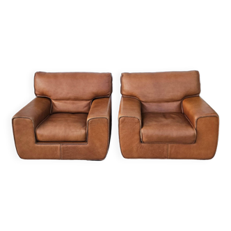 Pair of vintage club style leather armchairs signed roche bobois