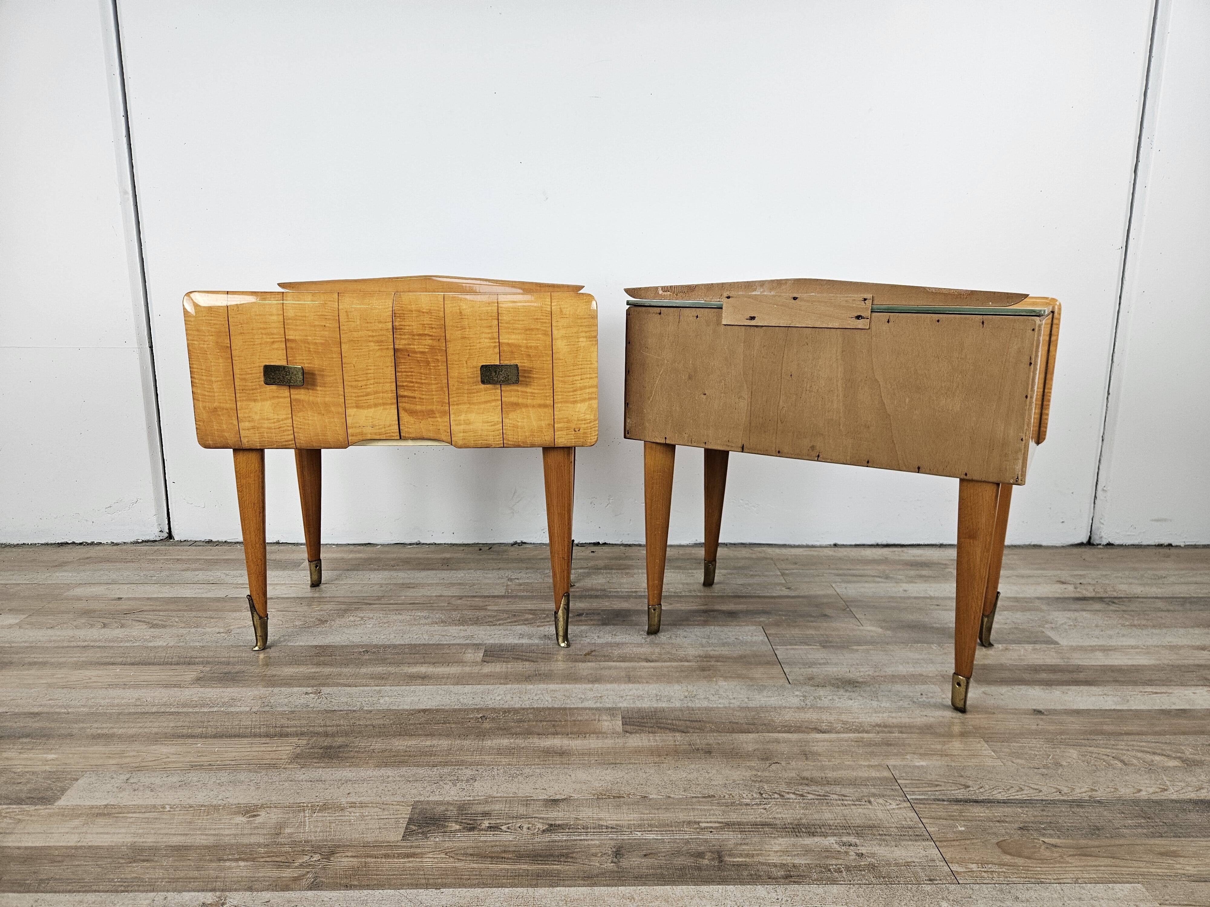 Mid-century nightstands in maple, brass, and glass