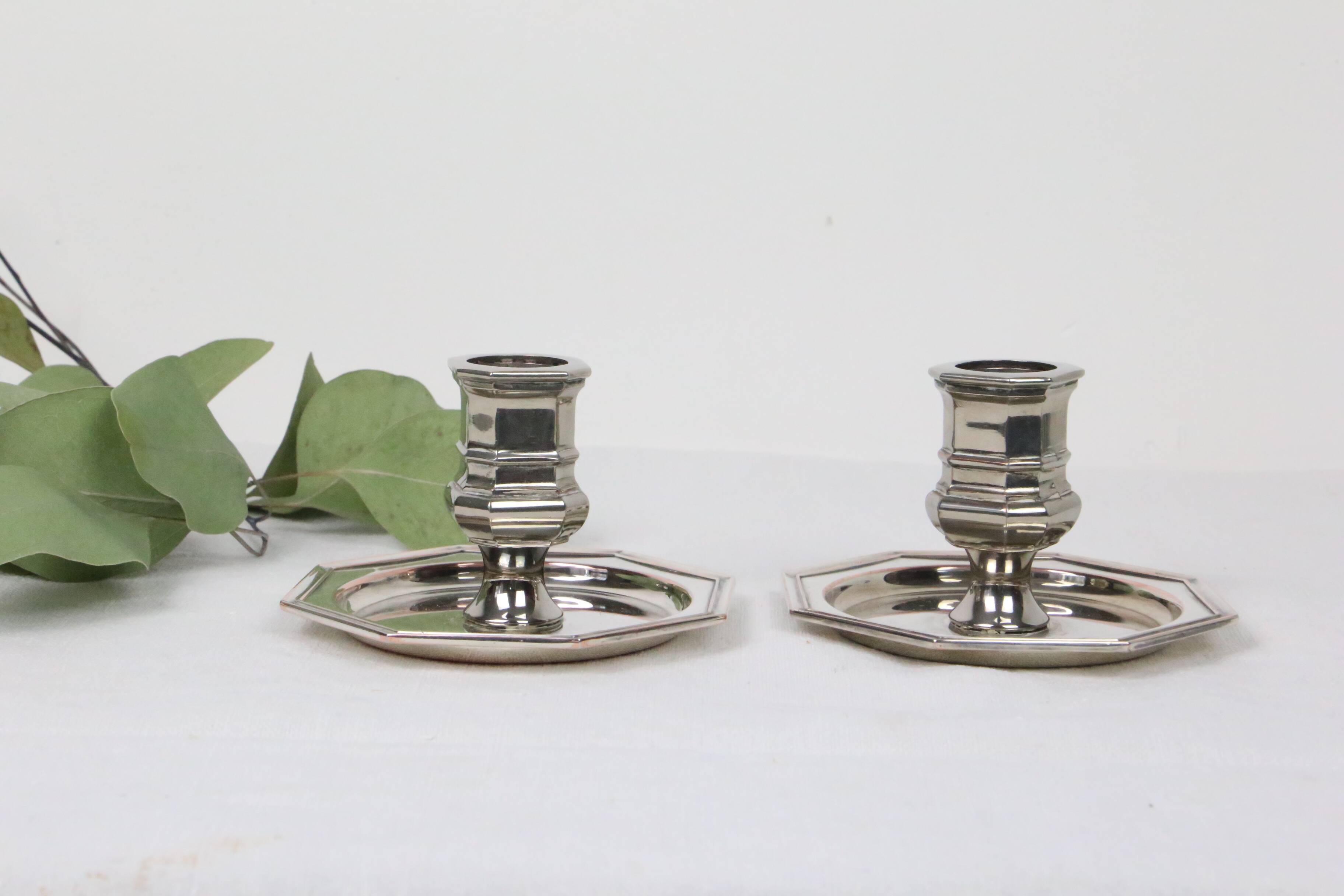 Pair of silver-plated metal candlesticks