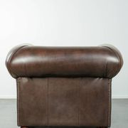 Set of a smooth chesterfield sofa and armchair with a timeless English look