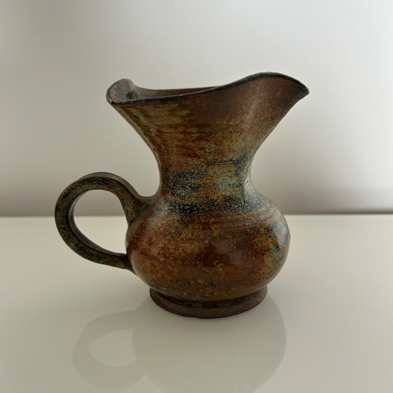 Patinated stoneware jug