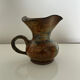 Patinated stoneware jug