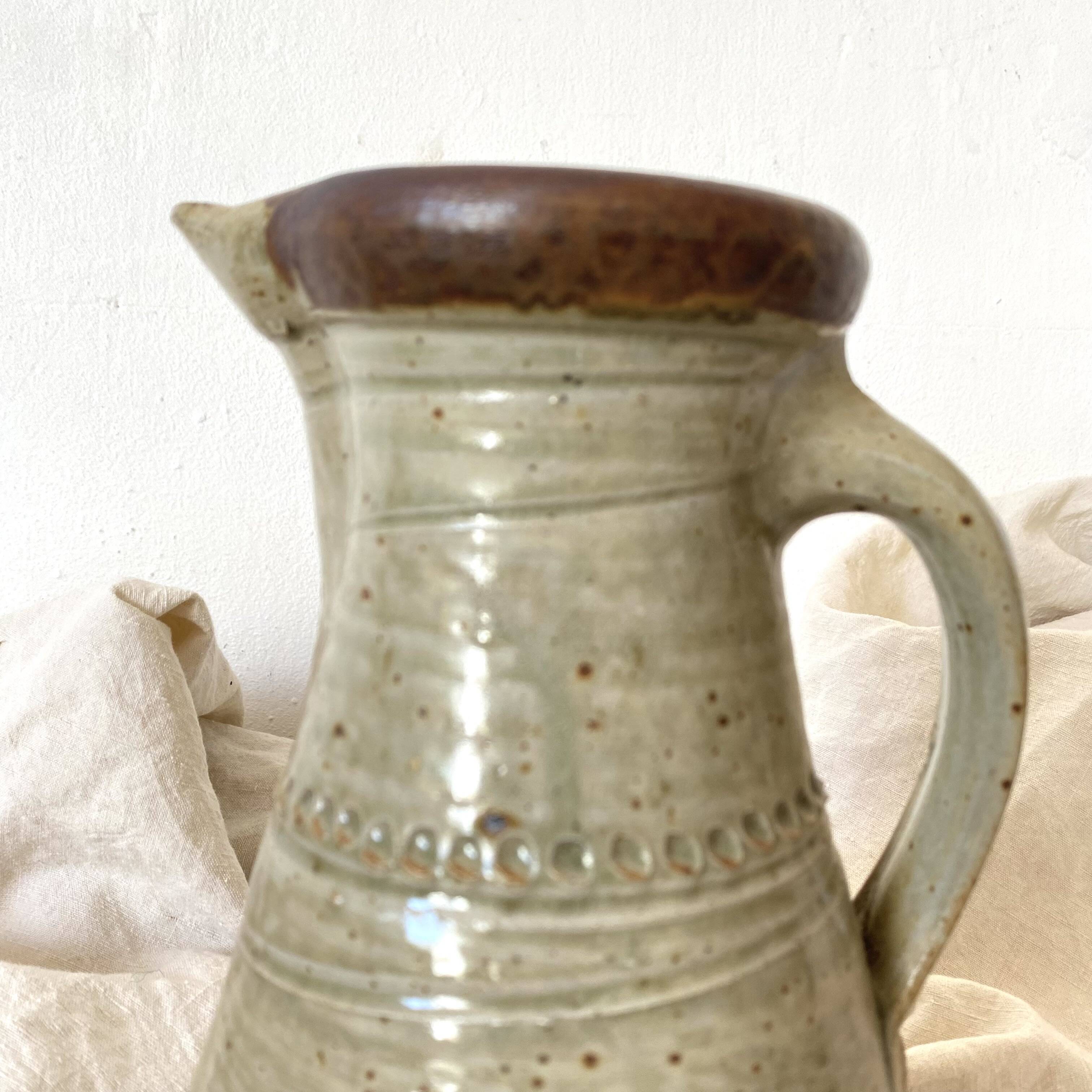 Vintage handcrafted terracotta pitcher
