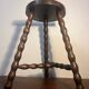 Round tripod stool with turned wooden legs