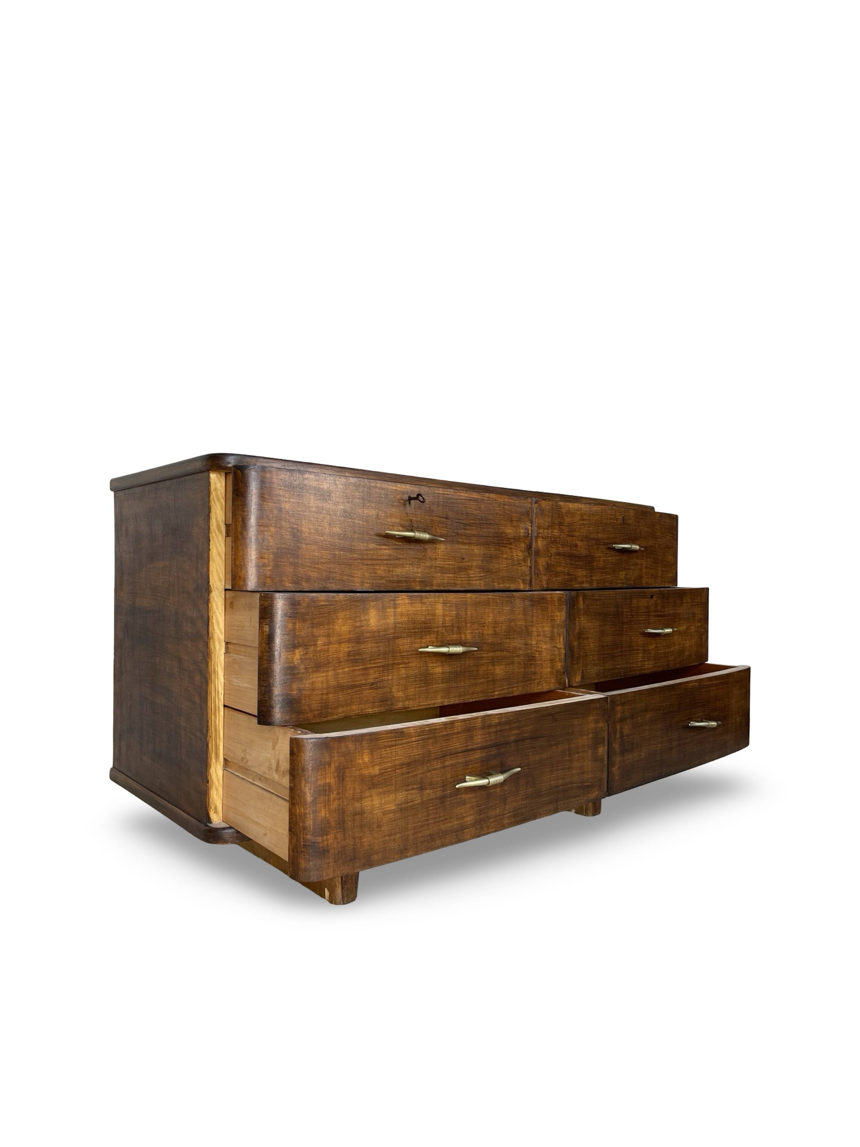 A vintage Italian chest of drawers, made of veneered walnut and solid wood,