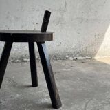 Black solid wood vintage tripod stool with angled back peg — France, 1960s