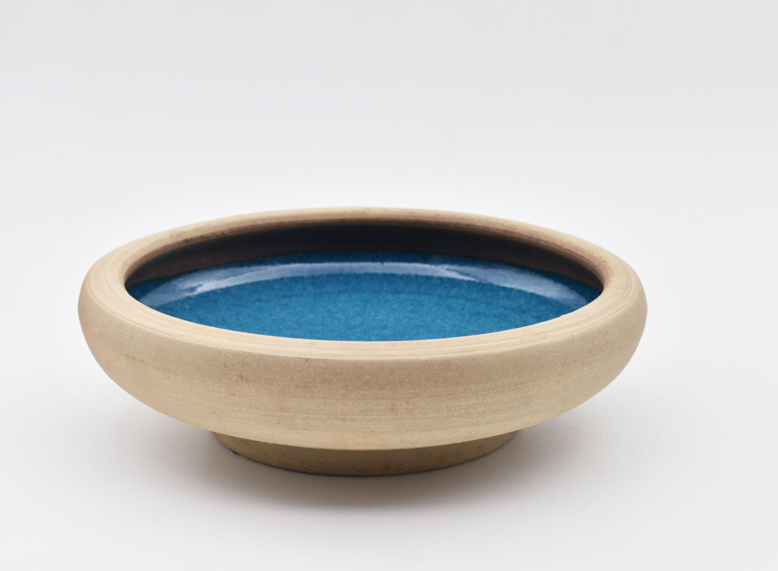 Blue enamelled sandstone cup