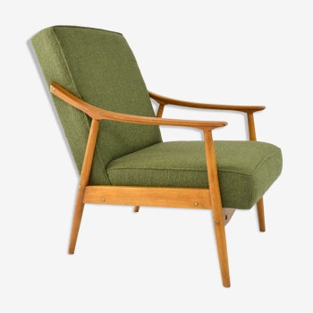 Green curved armchair