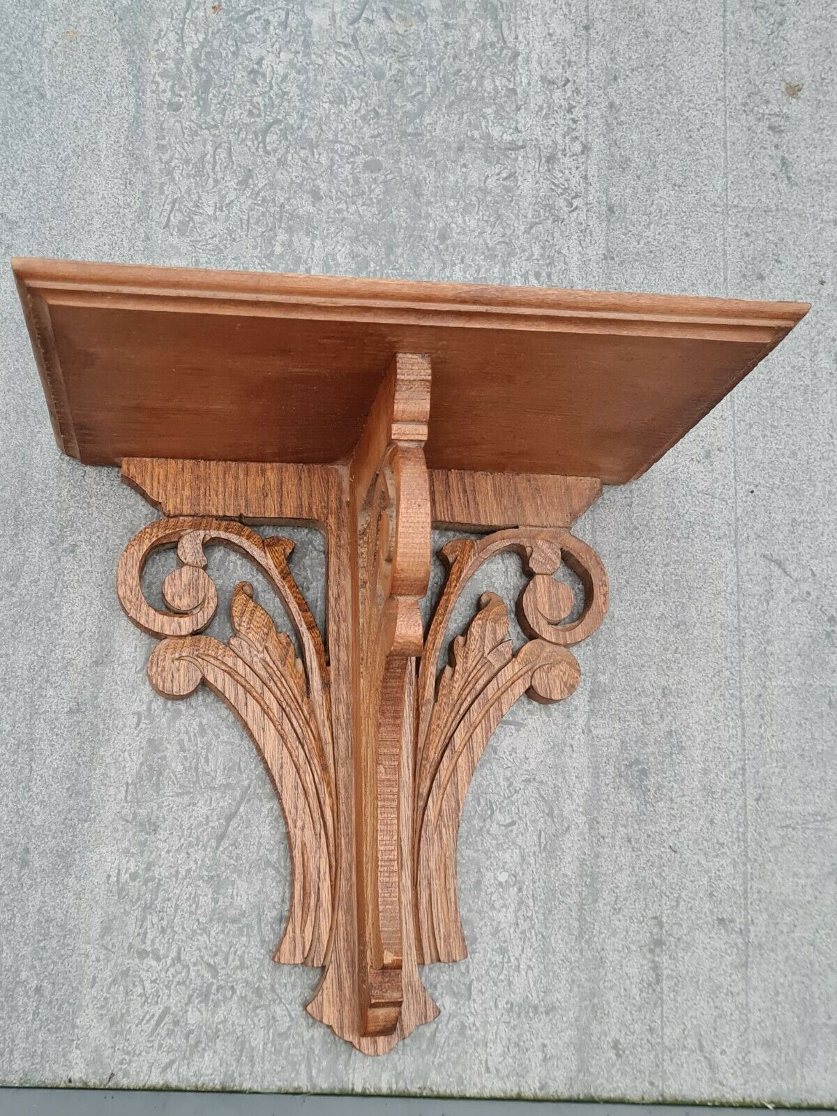 Openwork wooden wall shelf