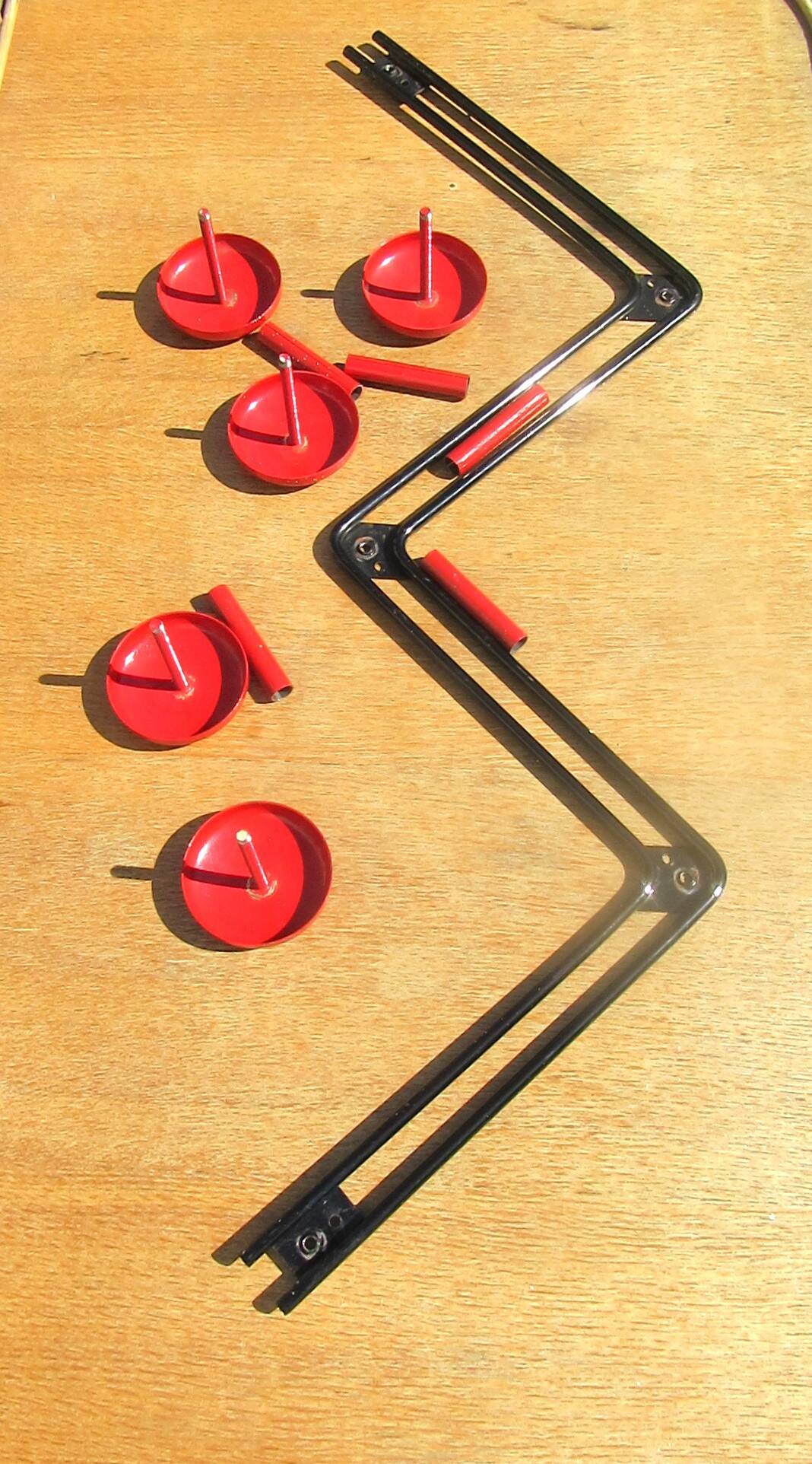 vintage black and red iron coat rack