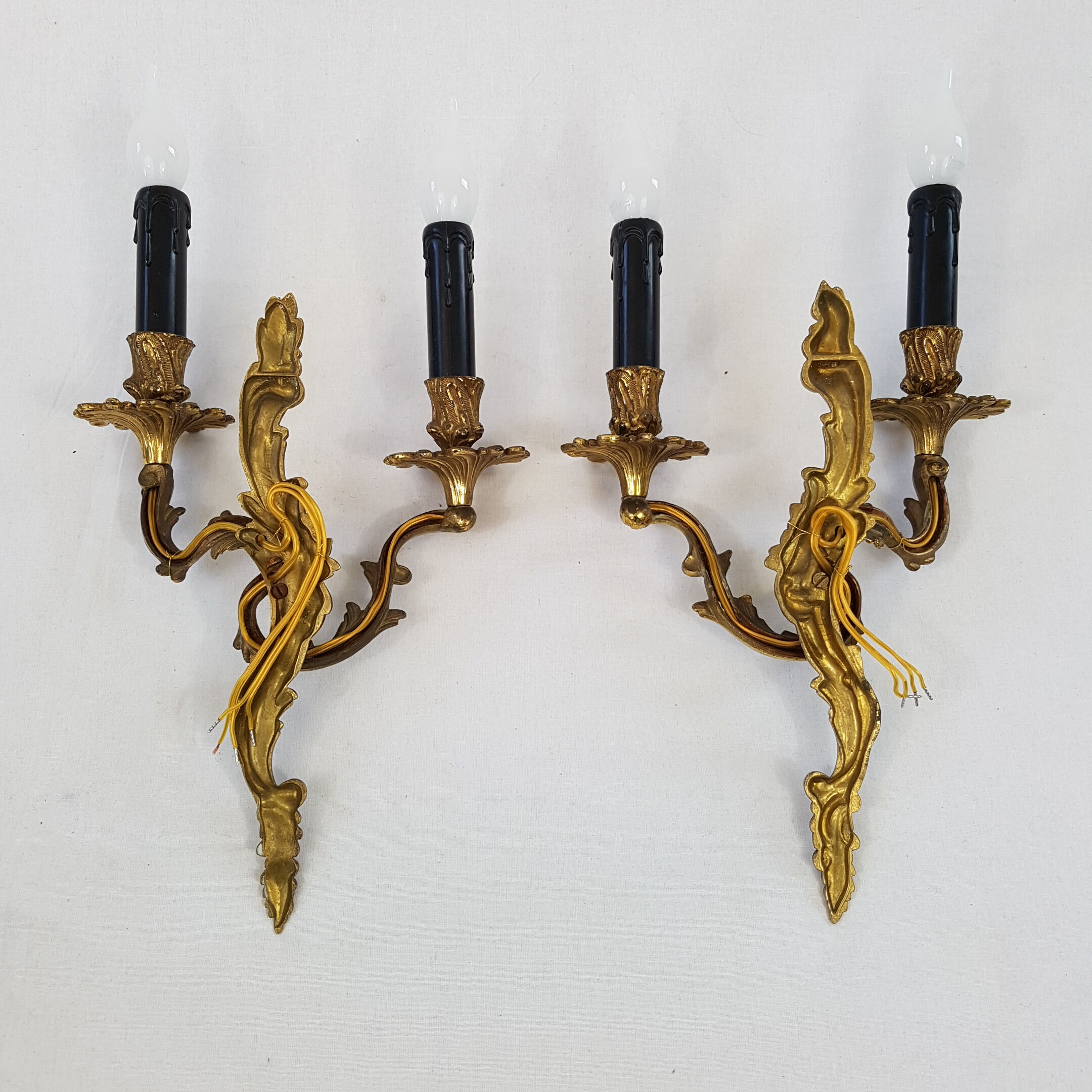 Pair of Louis XV style bronze wall lamps