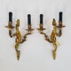 Pair of Louis XV style bronze wall lamps