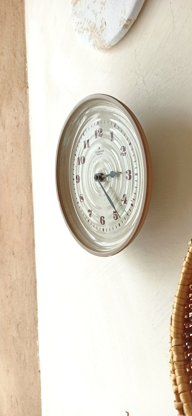 Clock in the shape of a round plate Junghans