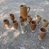 Service mazagrans and decanter in enamelled stoneware.