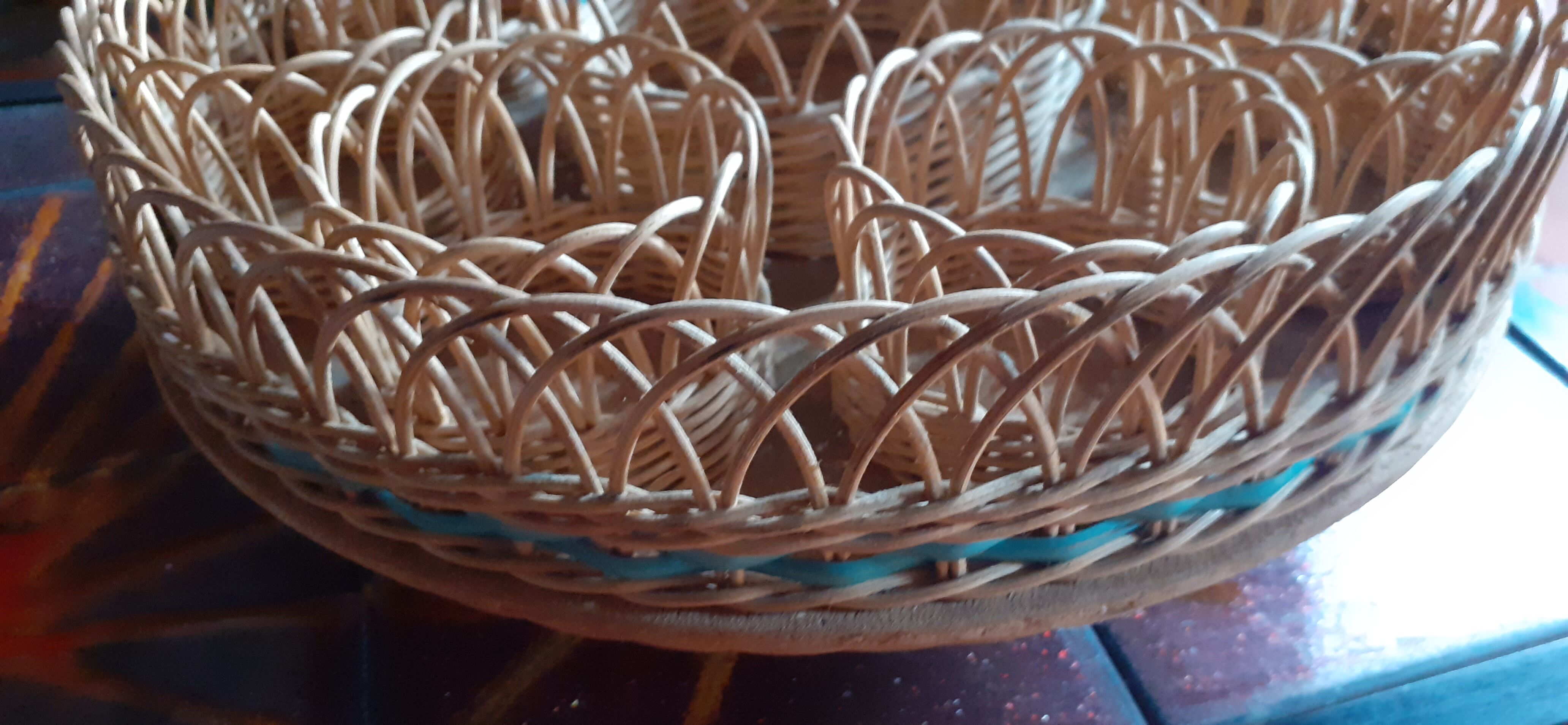 Glass holder and wicker bottle with green plastic water surface