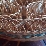 Glass holder and wicker bottle with green plastic water surface